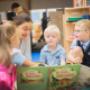 British International School, Bratislava - Teacher reading a book with Reception children